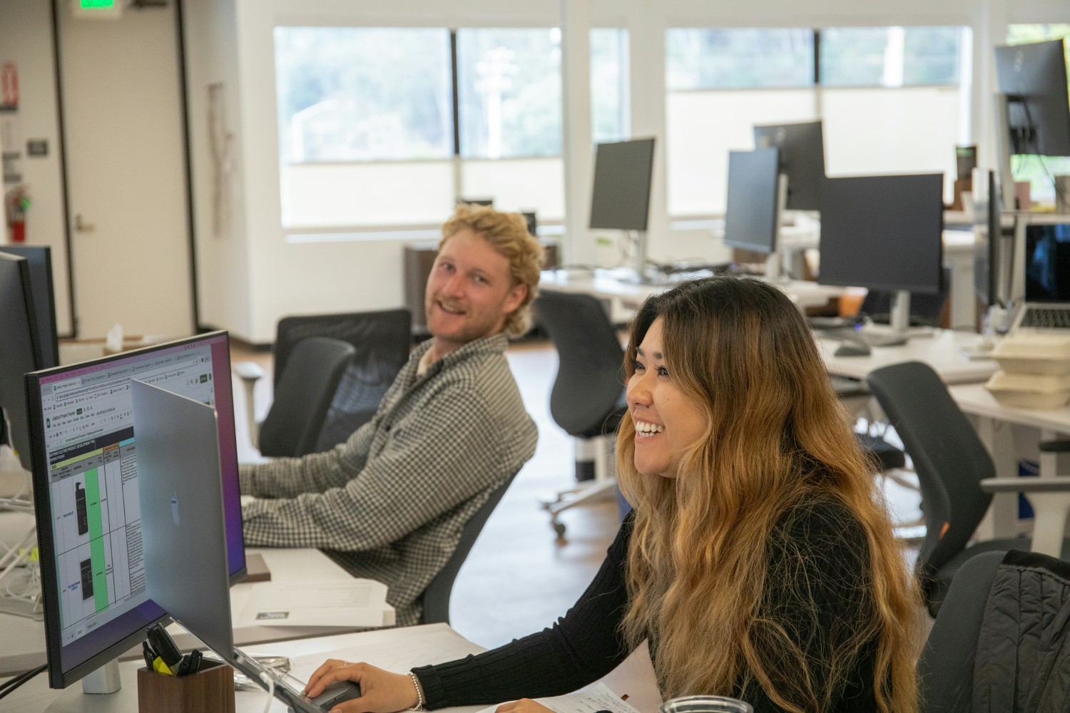 Some of our team enjoying their new desk assignments at our Base Camp! 