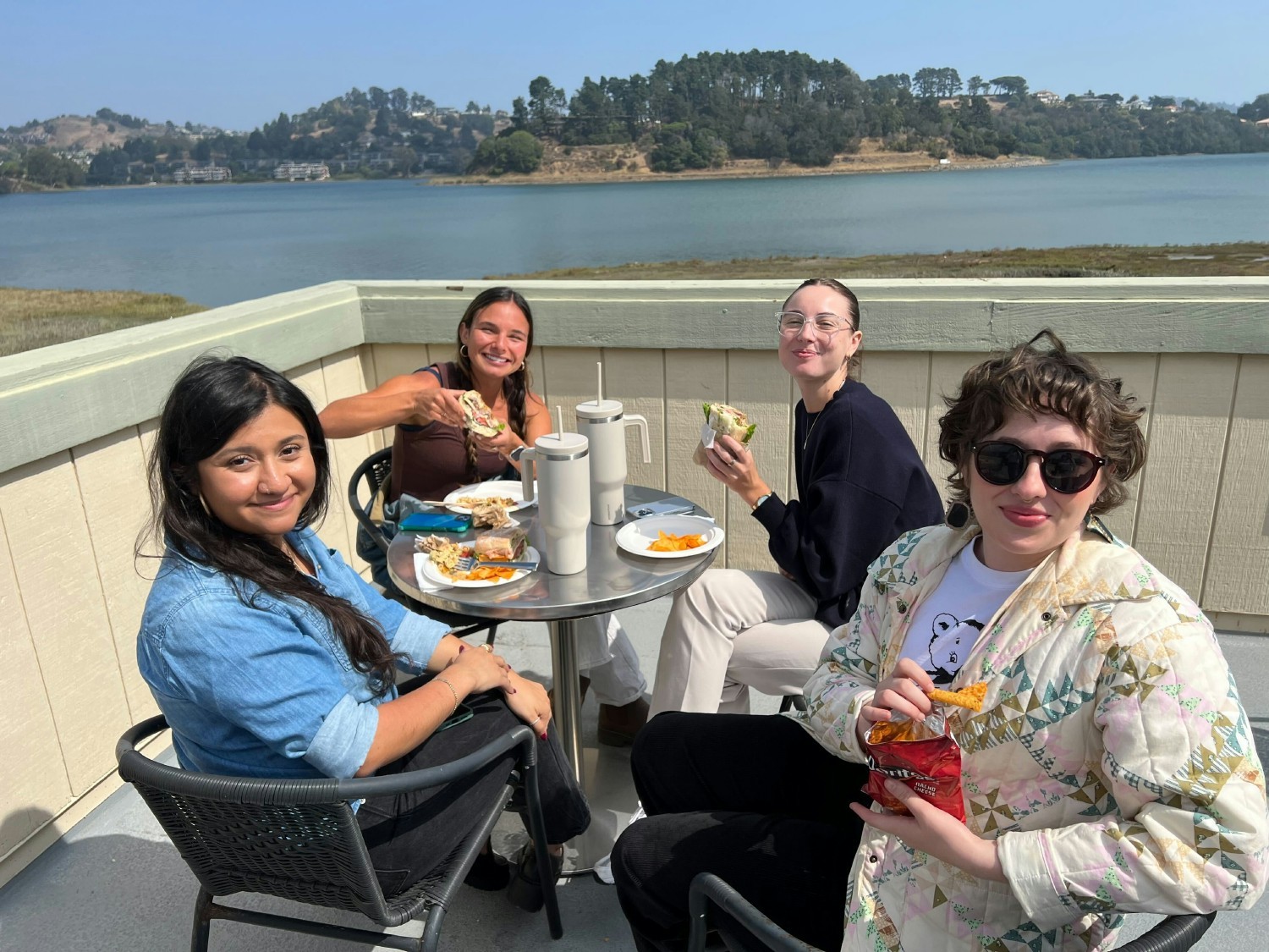 Part of our Creative team enjoying lunch on our back patio at our Base Camp headquarters overlooking the water