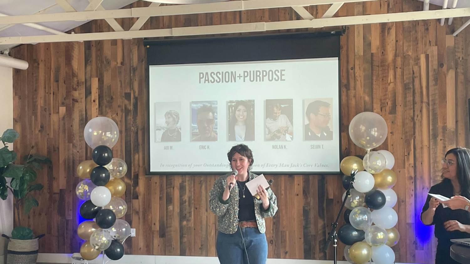 One of our team members accepting an award during our team Values Awards, in which she won for Passion and Purpose.