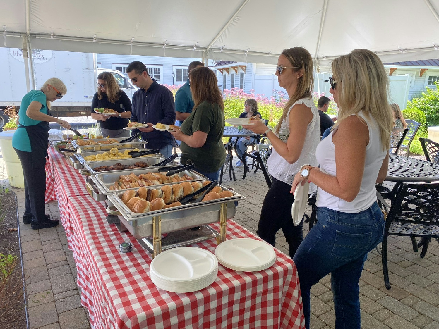 Summertime not only brings holiday hours but also our on-site tent where we love to host summer cookouts!