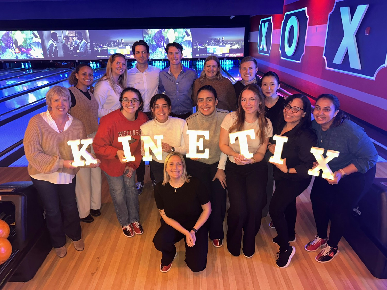 TKG colleagues enjoy a night out bowling.