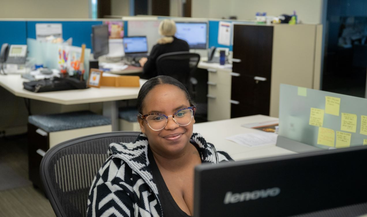 Employee working in communal area.