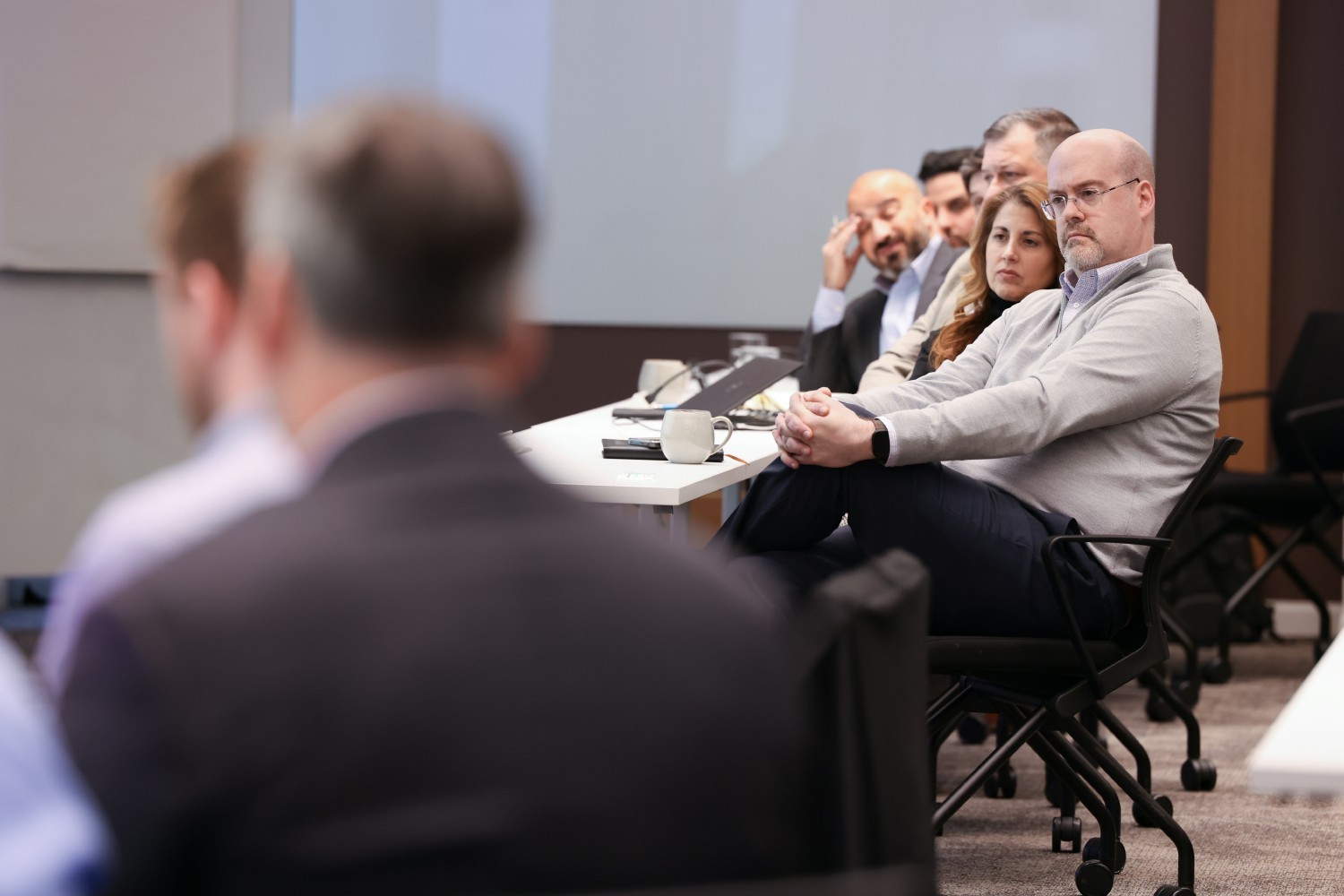 A group of Coface employees listen to a discussion with our Group CEO during a special visit to the United States.