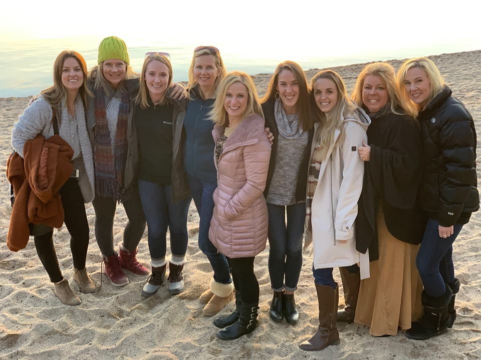 Peak Performer Club trip to Lake Tahoe - sunset on the sand, with wine in hand!