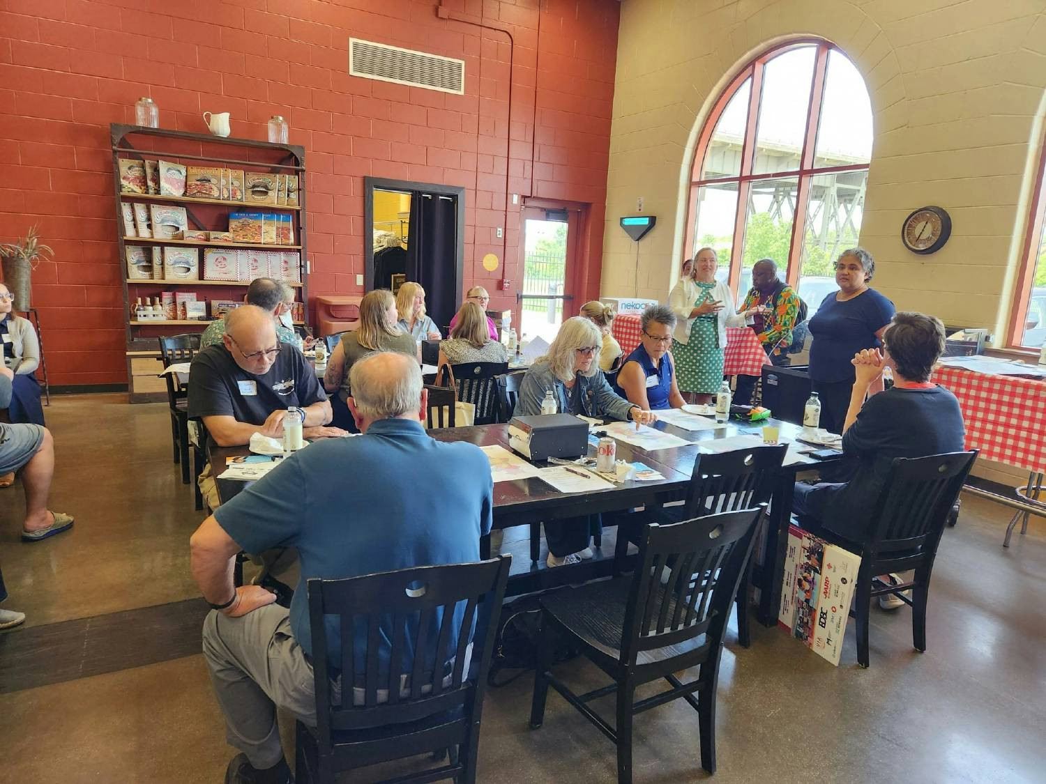 A local community group meets at Palermo's to discuss an educational opportunity for employees at a local university.