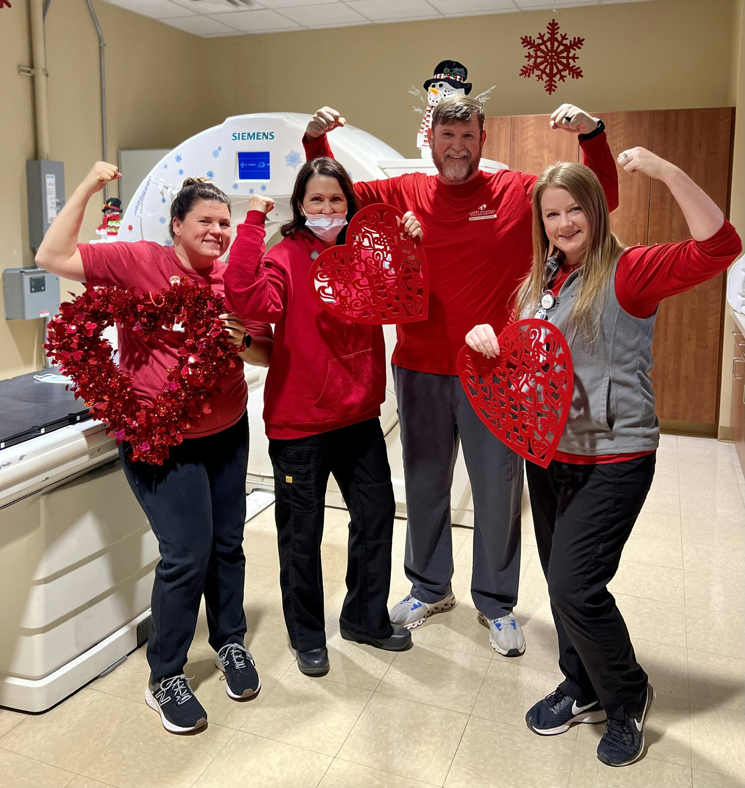 Radiation oncology team in red, raising awareness for women's heart health on Go Red Day