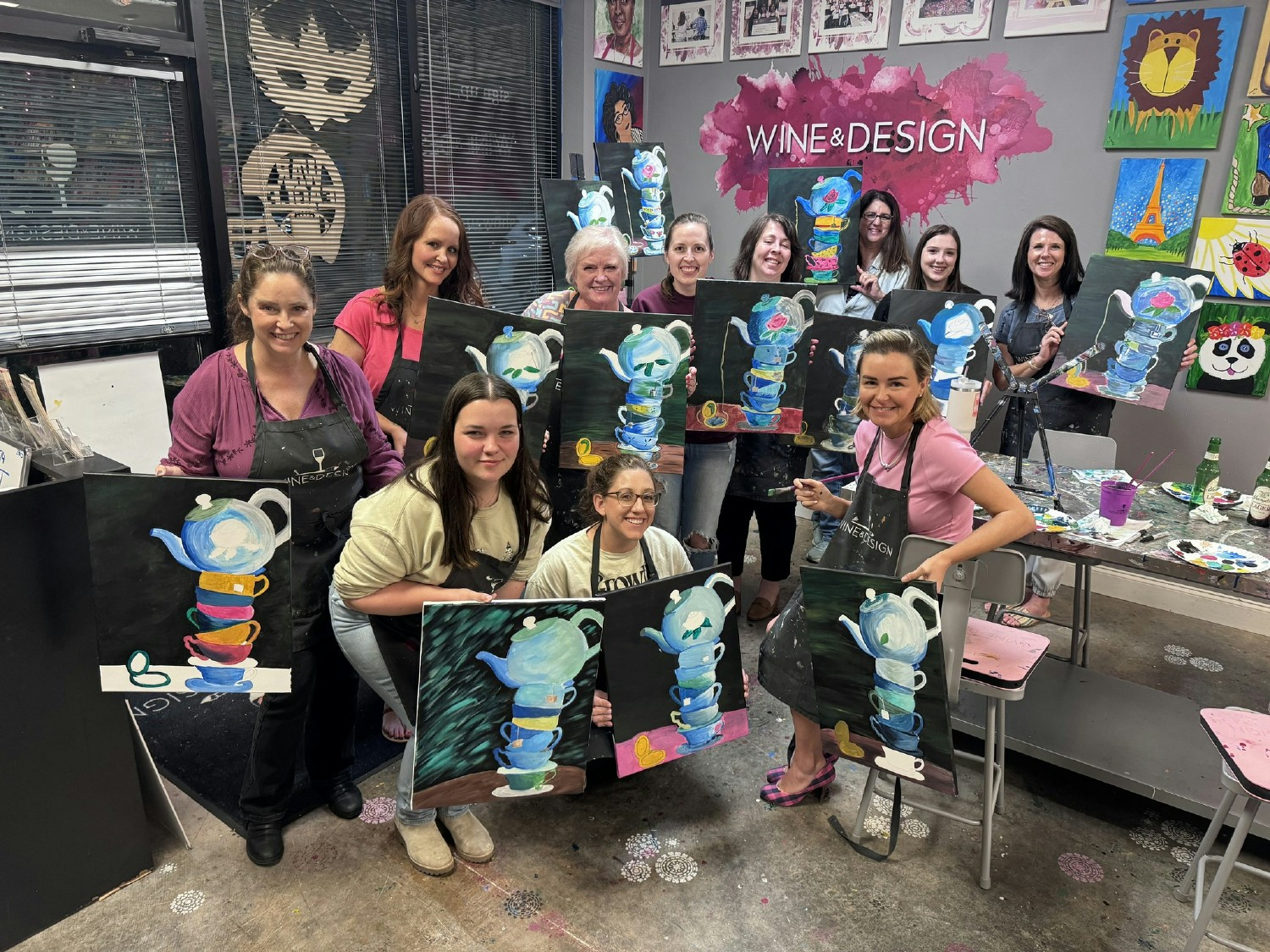 The ladies of Murphy Homes painting together at a team building event. 