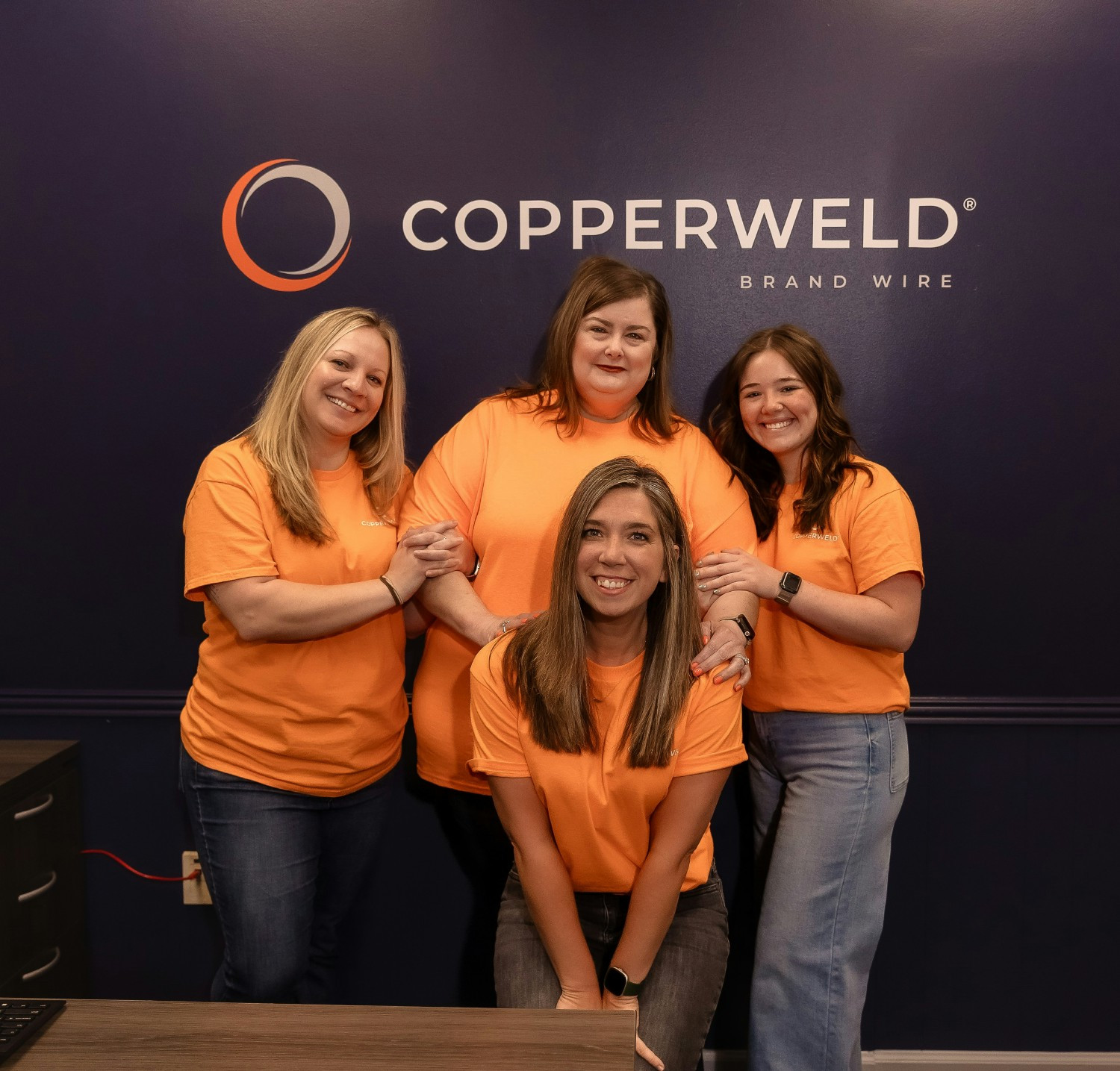 Our HR ladies rock their orange with Copperweld spirit.