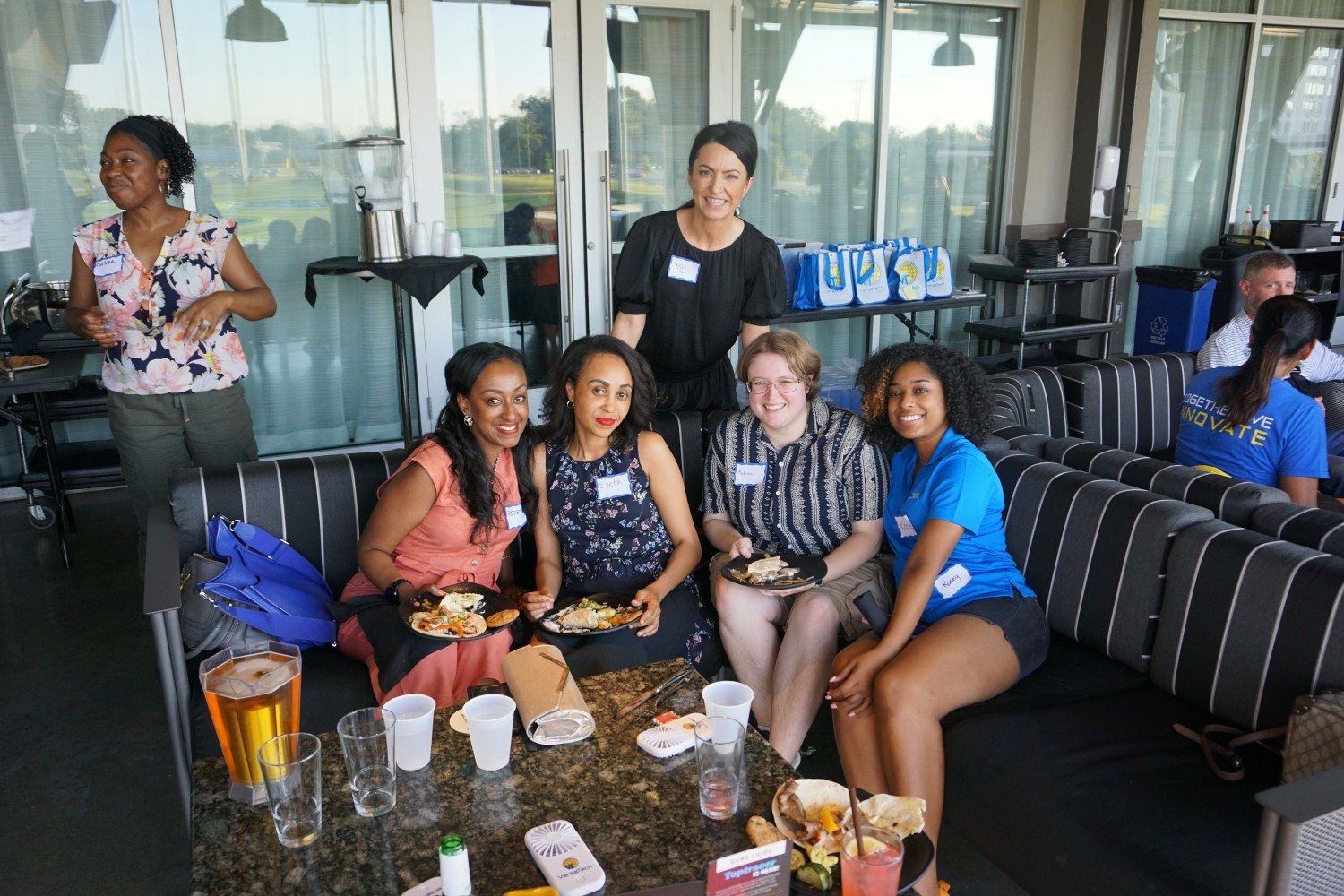 VersaTech team members enjoying time at TopGolf for our Summer All Hands Party, celebrating VersaTech's birthday.