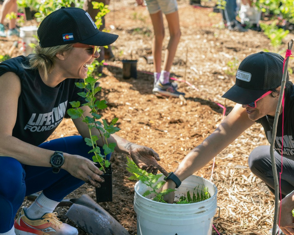 Two Life Time Team Members at a tree planting community event in Minneapolis, MN.