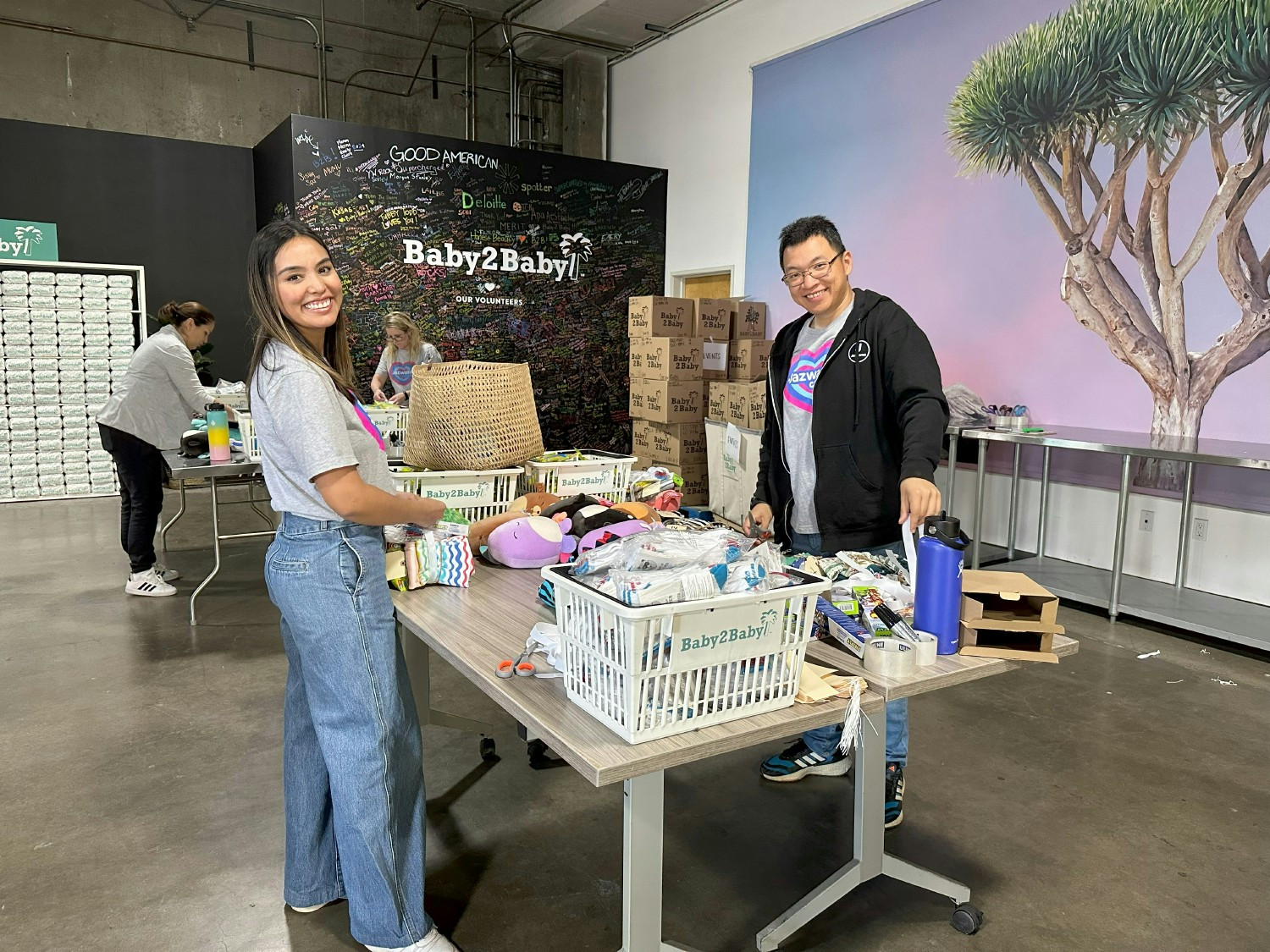 Jazmanians volunteer with Baby2Baby to pack kits of essentials for families in need