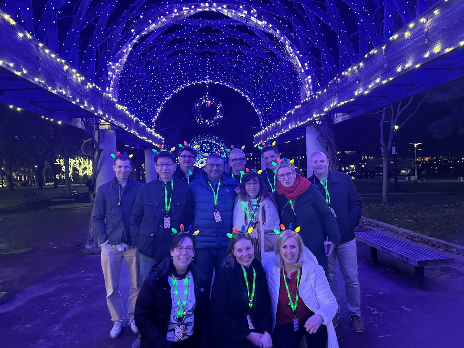 Team posing as we walked through the Christohpher Columbus Park taking in the festive lights after a fun filled event. 