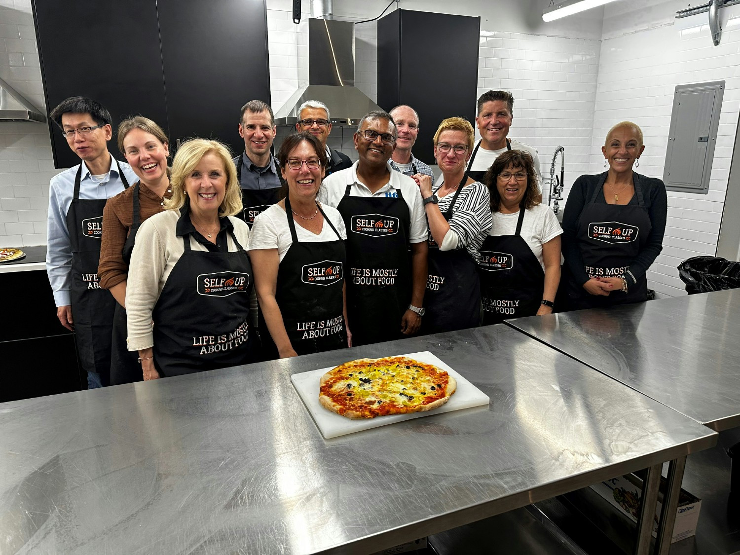 Life Bio team making their own pizza's. Best part was that we got to eat the pies we made. Yummy.  