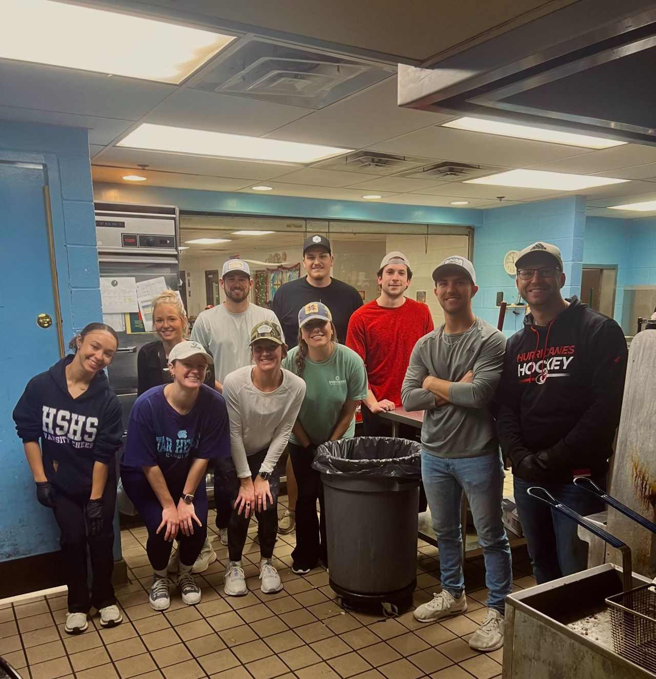 Team members at a volunteer event at the Raleigh Rescue Mission.