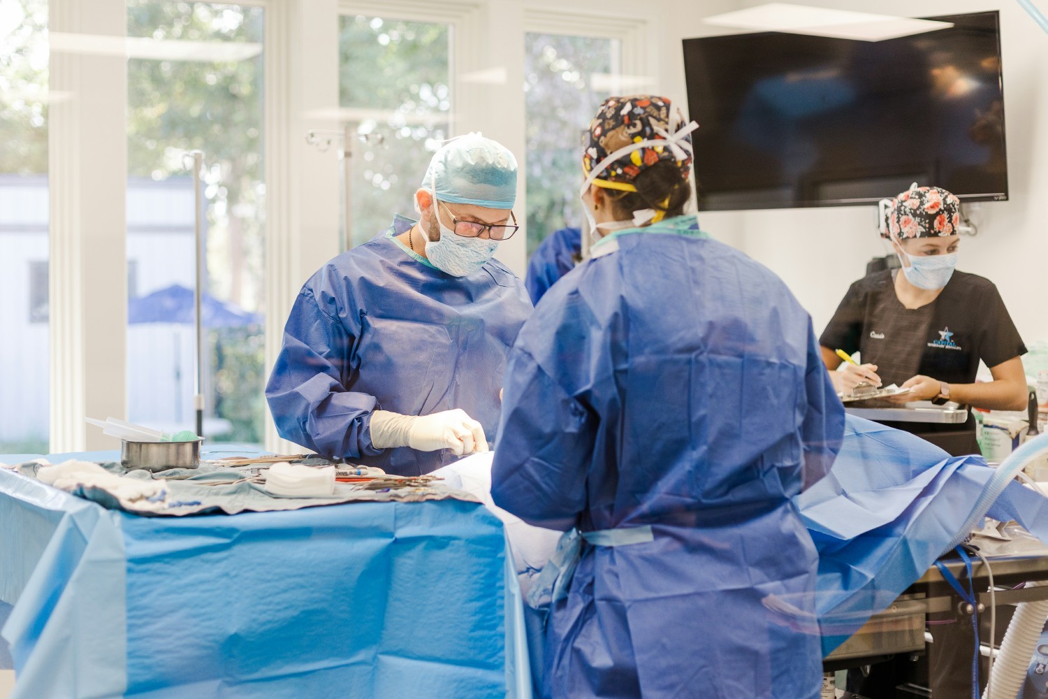 Dr. Carl Jehn performing surgery. 
