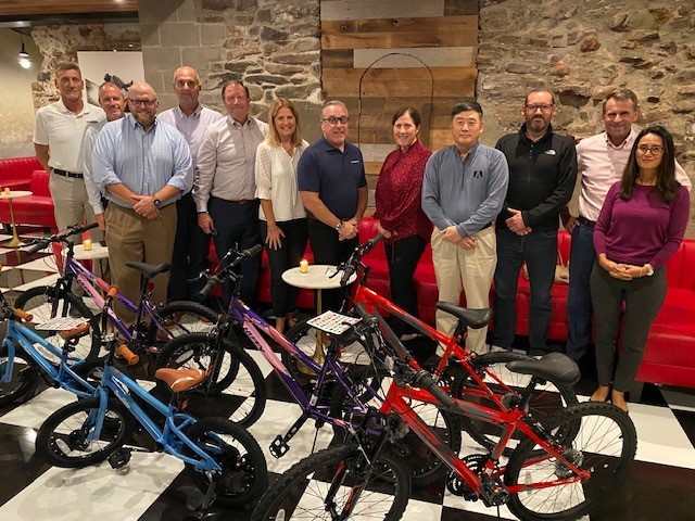 Our Executive Leadership team performing a collaboration exercise to assemble bicycles for charity.