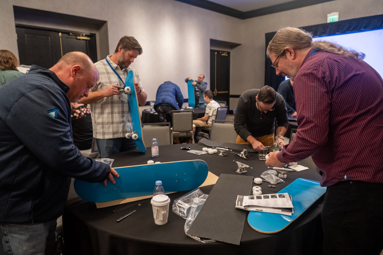 Teamwork with impact! ActivTrakkers build skateboards for foster youth, turning collaboration into a meaningful cause.