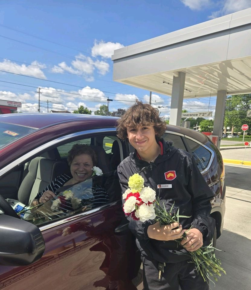 Handing out flowers for Mother's Day