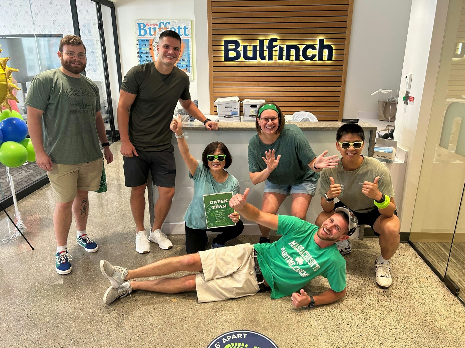 Team Green celebrating their team spirit at the 2023 Summer Outing Scavenger Hunt!