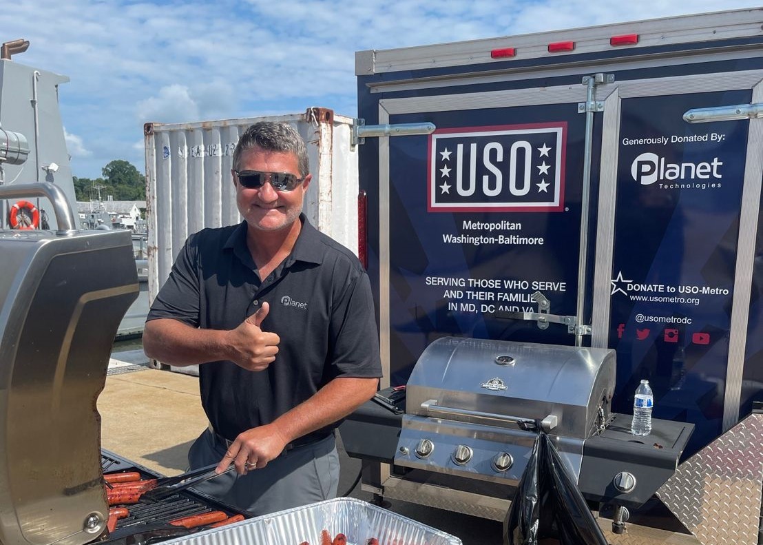 Planet Technologies proudly supports the USO - Here's one of our team members working the grill at a recent event