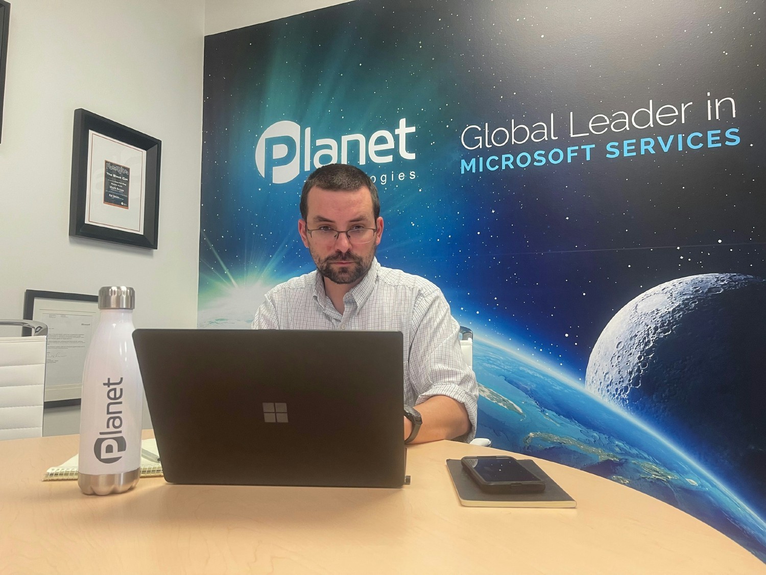 One of our Planet Technologies team members in the Company Lounge working hard at headquarters
