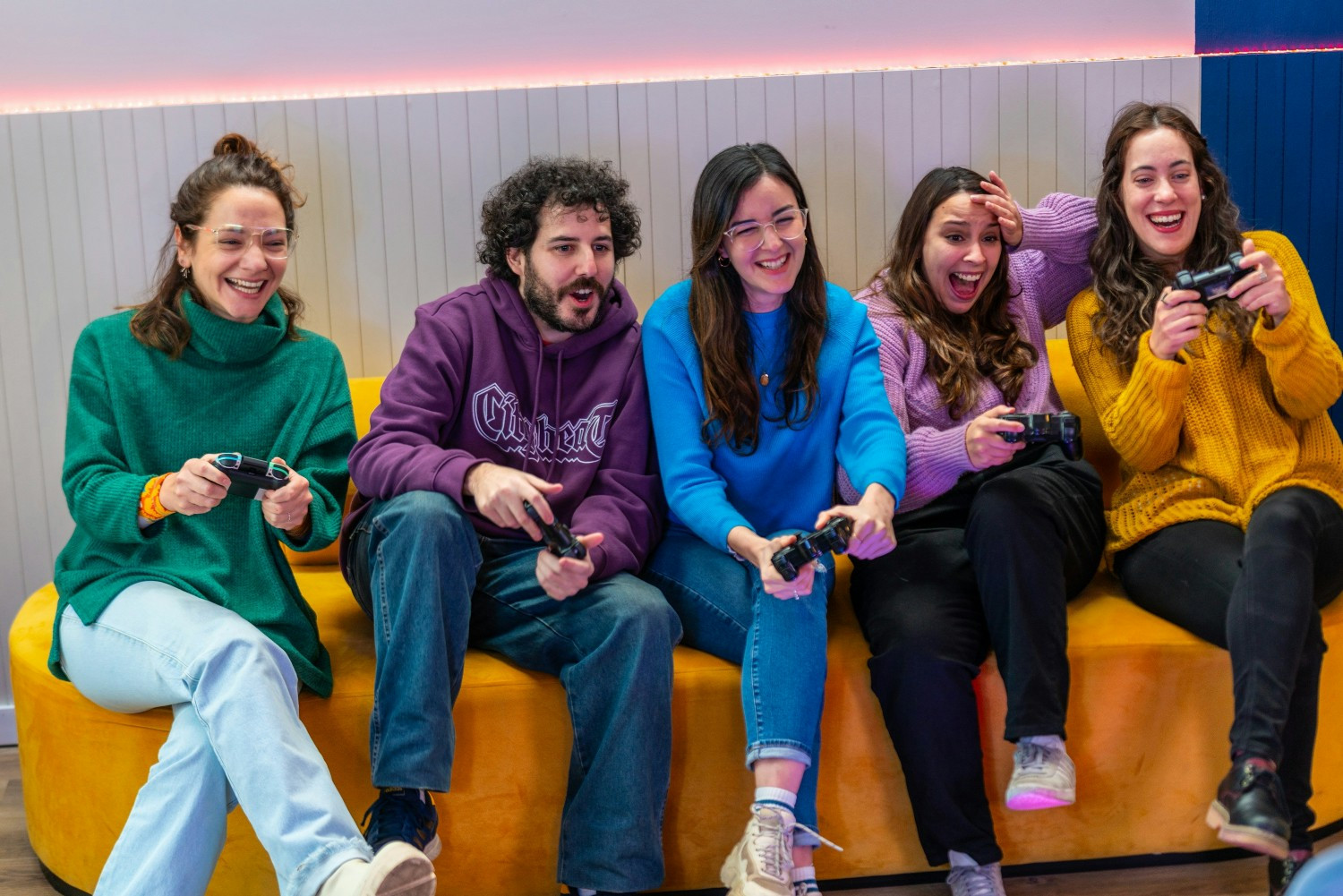 An operative team enjoying a game session during an after-office hangout