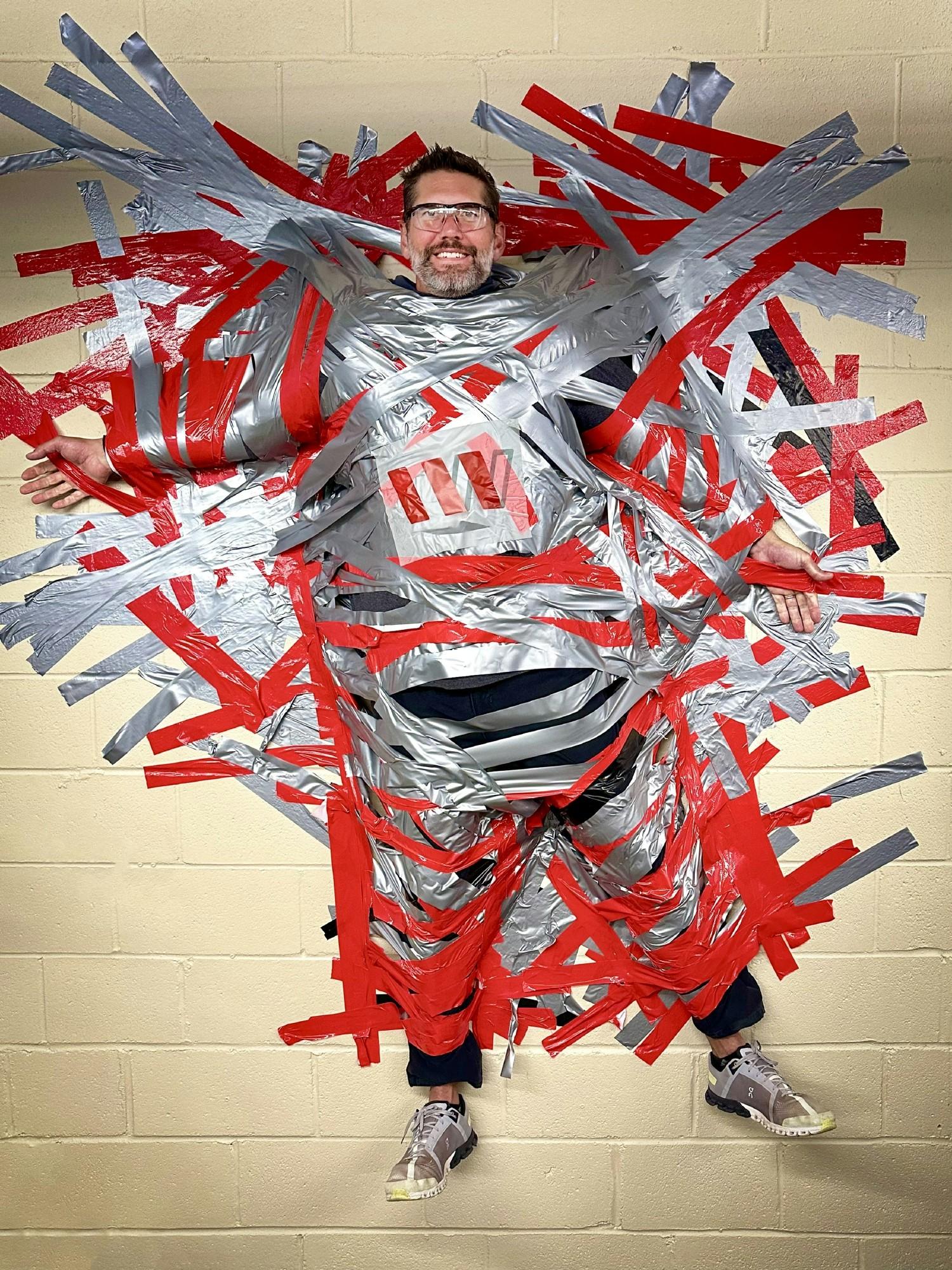 Our CEO is always a good sport! He even agreed to be duct taped to the wall for a charity fundraiser.