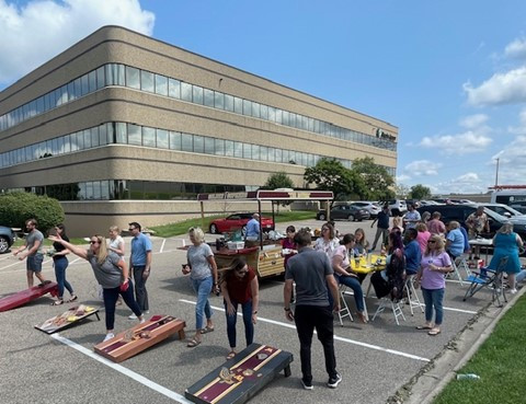 Enjoying and office lunch and corn hole tournament