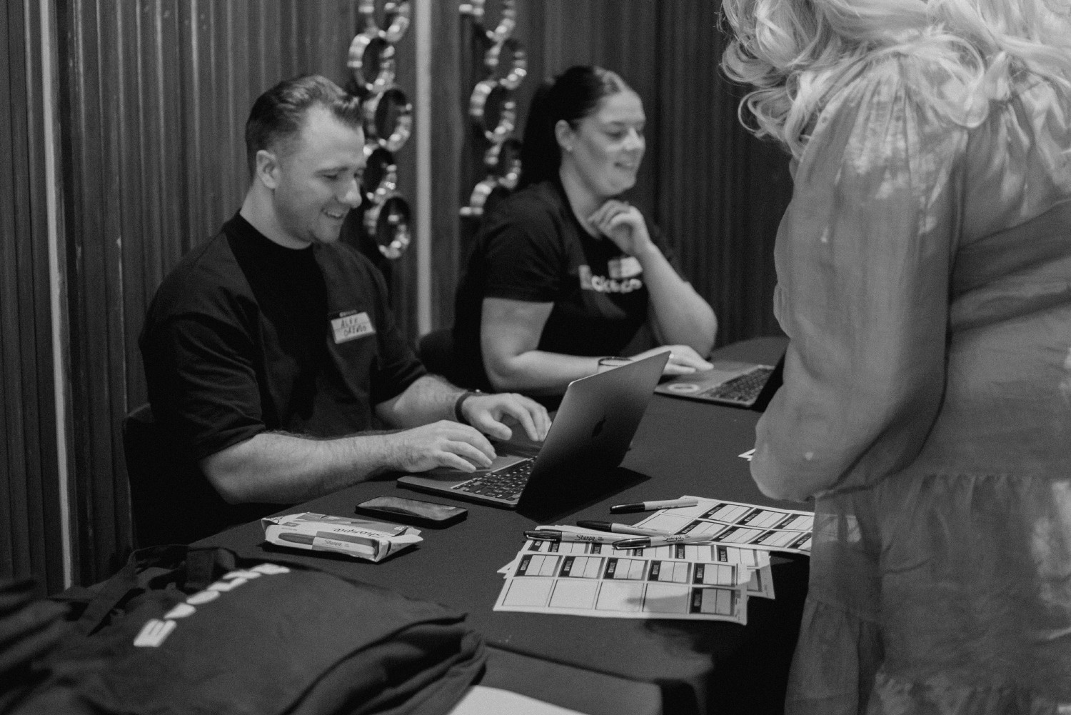 Alex North and Alannah Donald checking in attendees to our 2023 Evolve Sydney conference