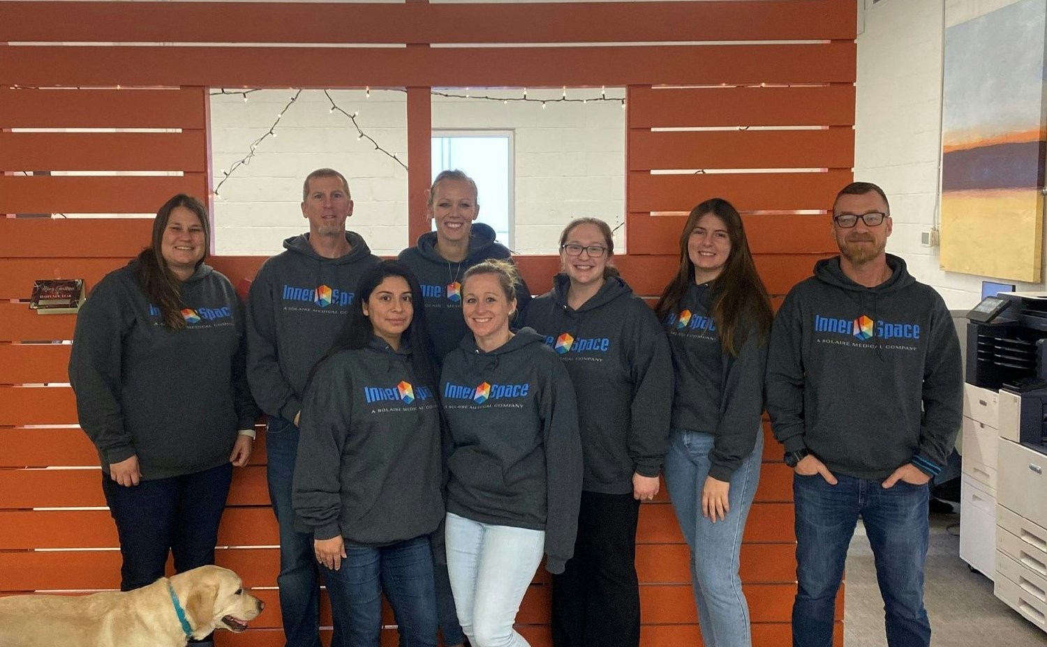 Sweatshirt day. Office team showing off their new sweatshirts. Winnie our office dog, keeping them in line. 