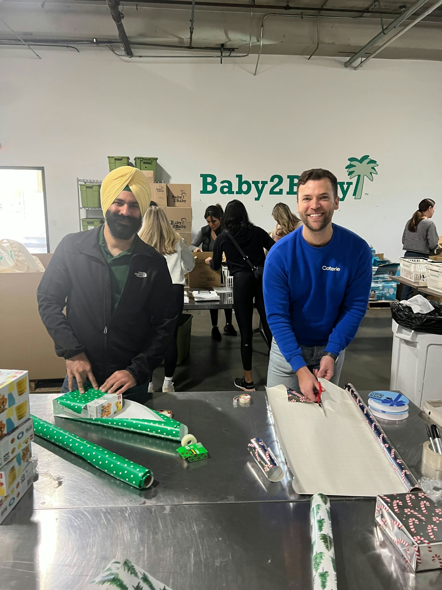 Coterie volunteering with Baby2Baby, a longterm impact partner