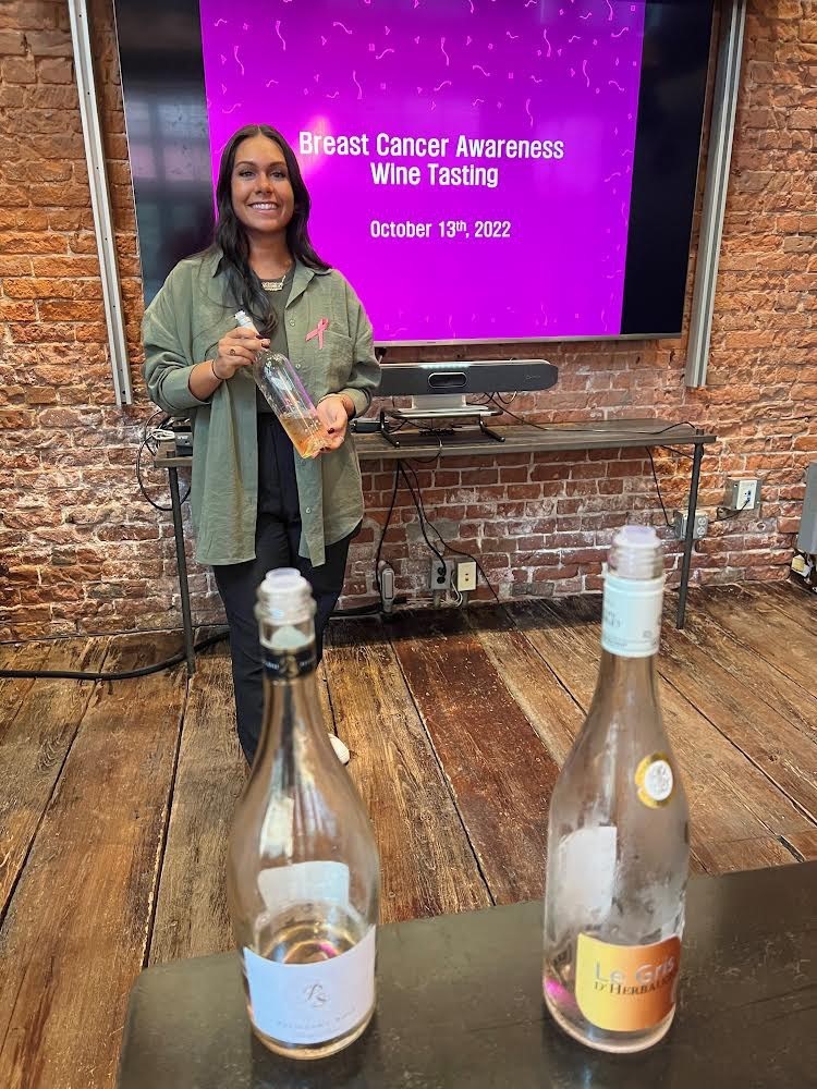 Holding a tasting of rosé wines in our Norwalk office to generate awareness & support for Breast Cancer Awareness Month.