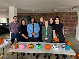 Fall Festival Pumpkin Painting contest photo.  Staff could compete, play games, or share in the fun with food/drinks.  