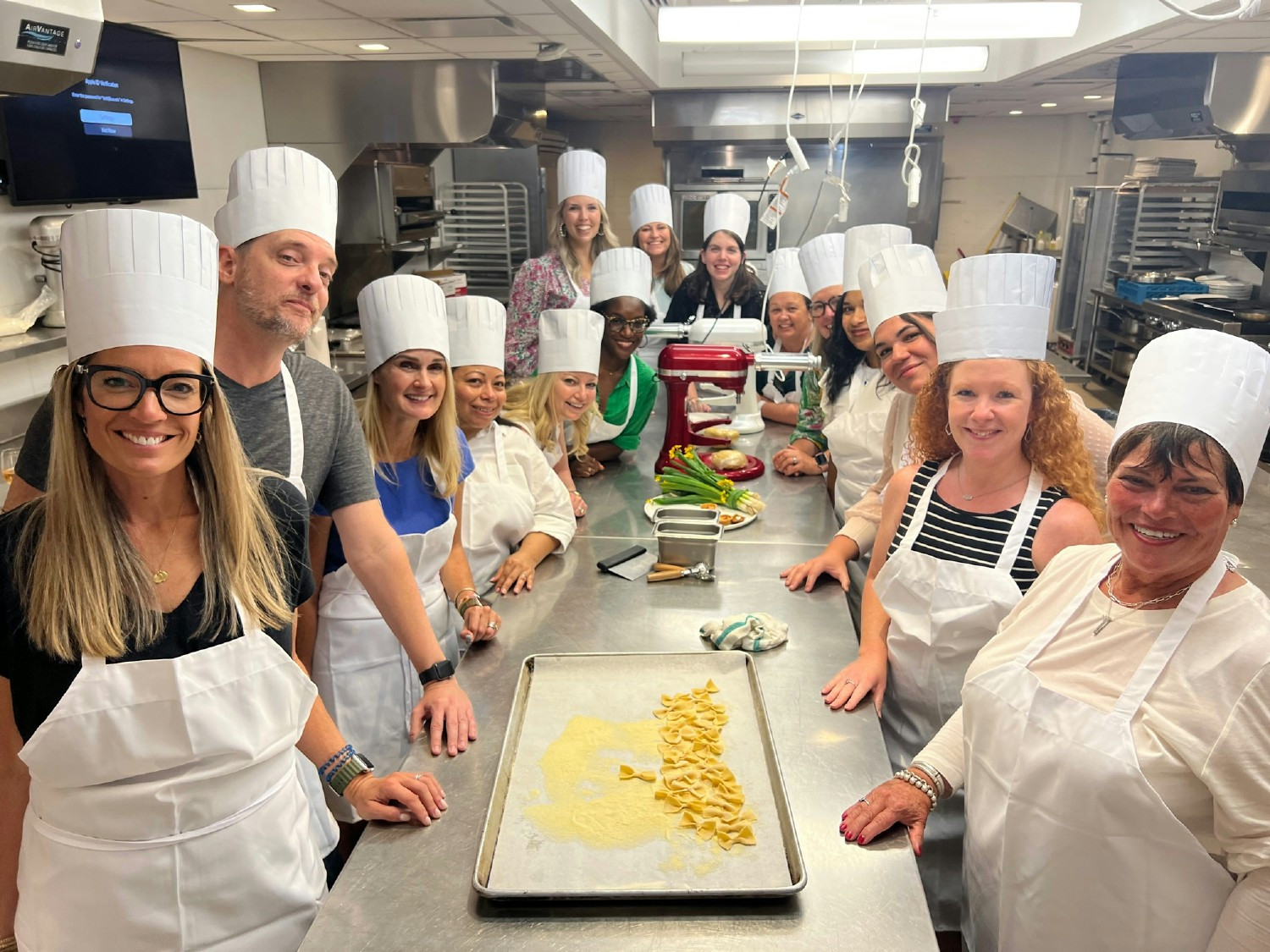 We have fun together on and off the job! We're channeling Bobby Flay at this team building event! 