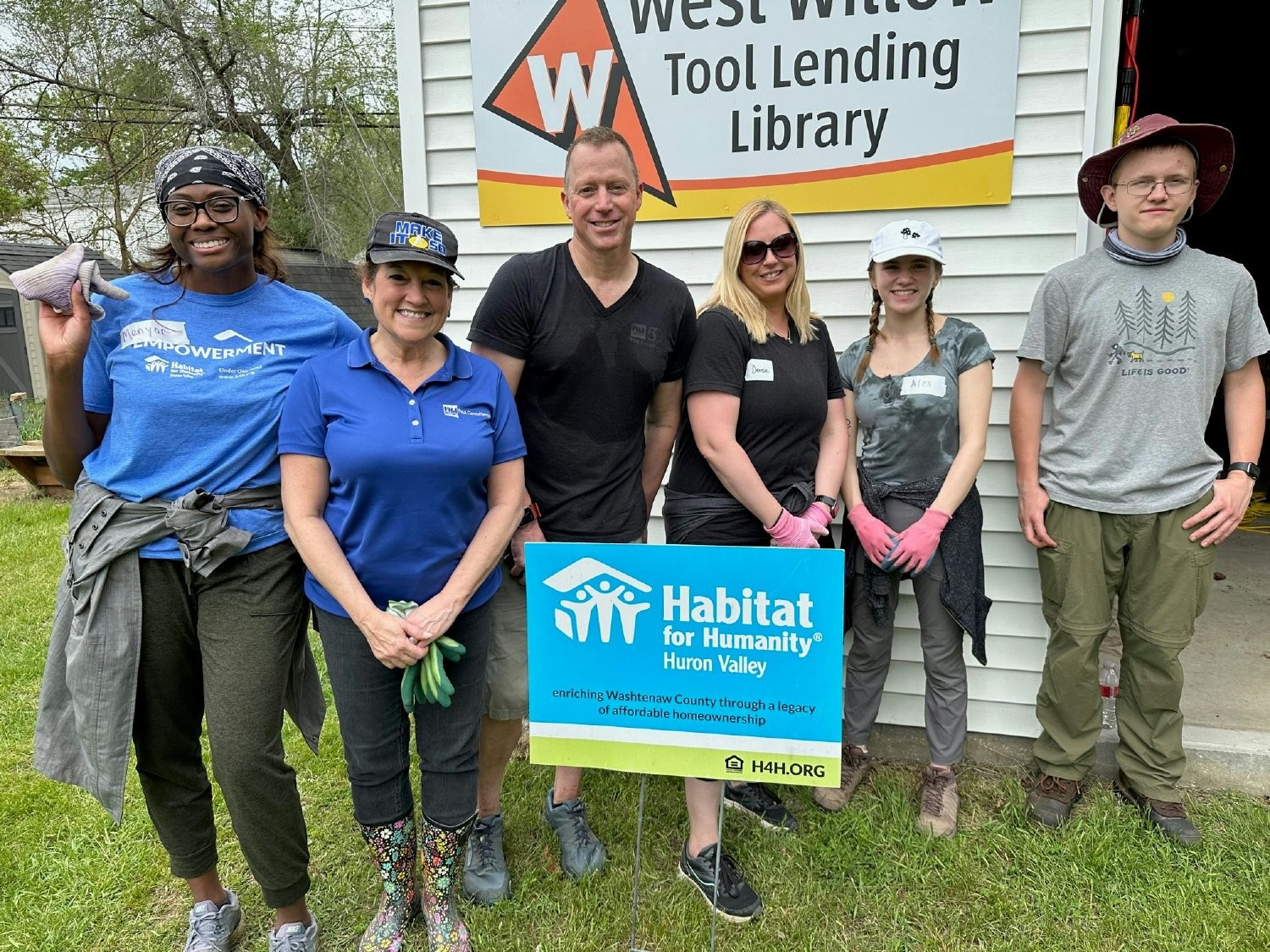 Employees from the Ann Arbor and Detroit offices participate in a Habitat for Humanity clean-up event.