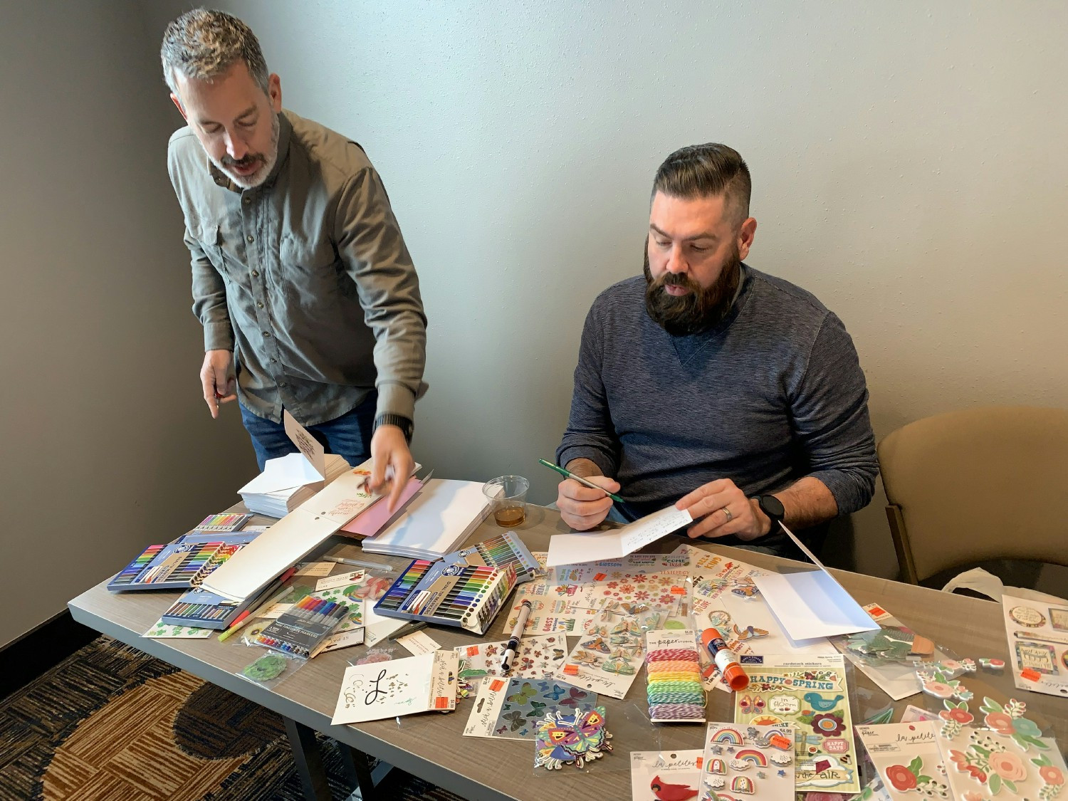 The Call Design North America team using a variety of craft supplies while writing letters to local seniors