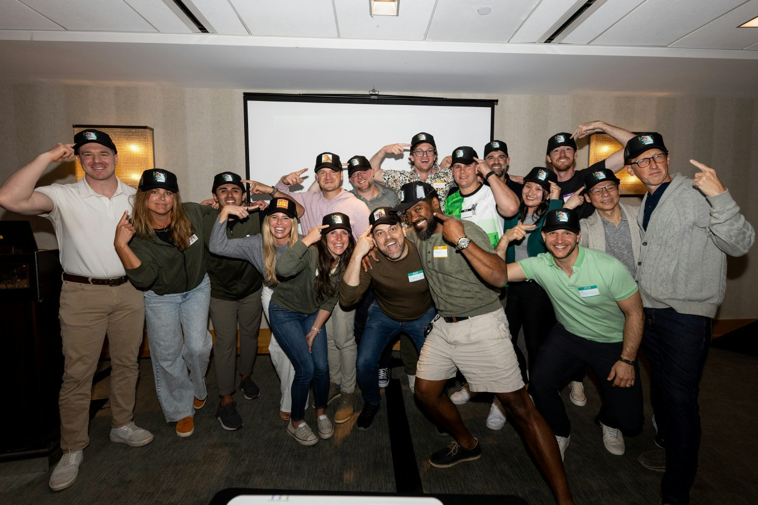 Members of the Unstructured team show off their team hats at a company-wide offsite in California.