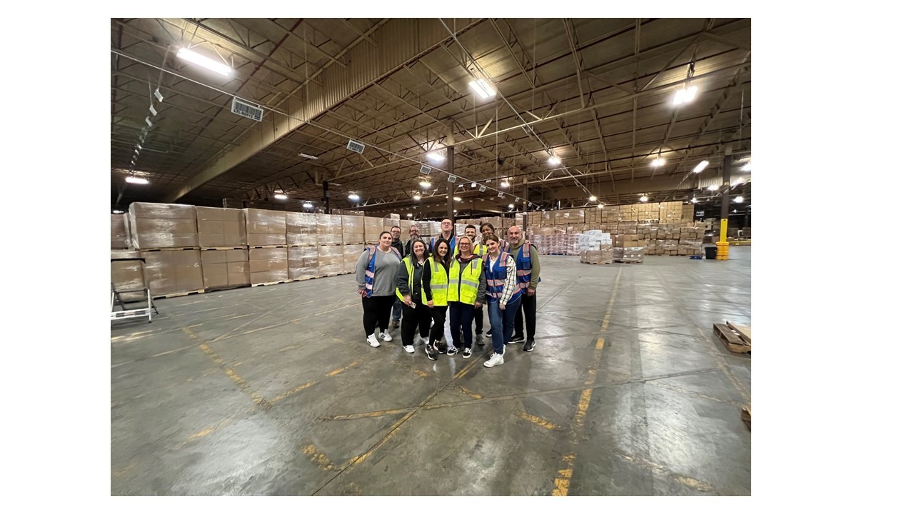 Corporate Team members touring one of the Bunzl Retail Warehouses