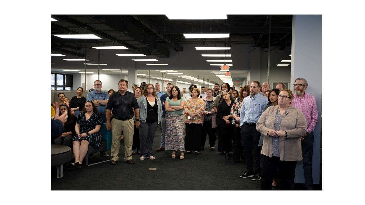 Corporate Employees listening to our Global CEO speak while visiting their location in Morton Grove.