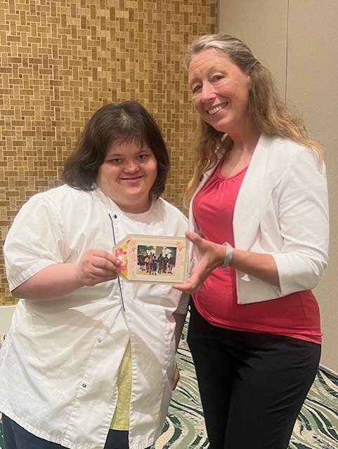 St. Joe Team members at Embassy Suites by Hilton Panama City Beach Resort decorating special memory picture frames.