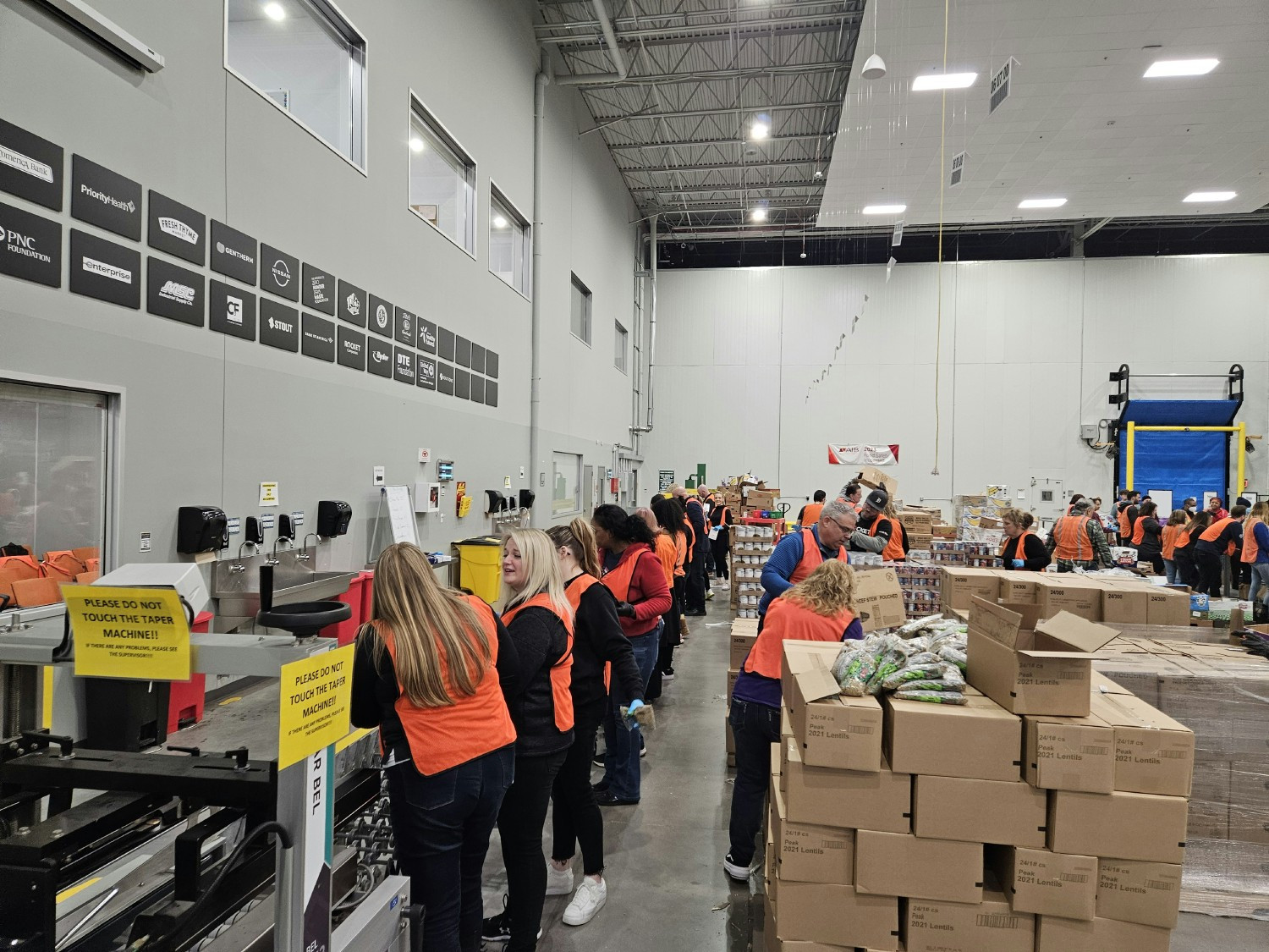 Employees as Credit Union ONE volunteers their time Forgotten Harvest.