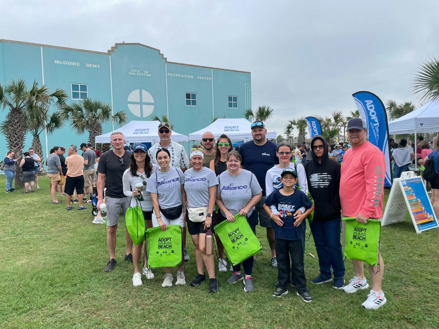 Alliance employees and their families volunteering at an Adopt A Beach event to clean a local beach.