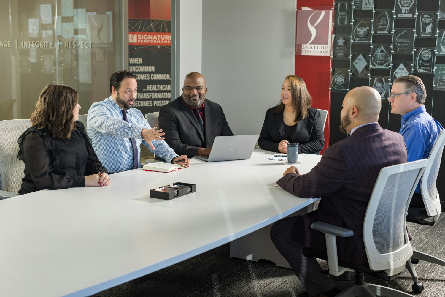 Associates collaborate in our modern meeting spaces to strategize as we move toward the achievement of our mission.