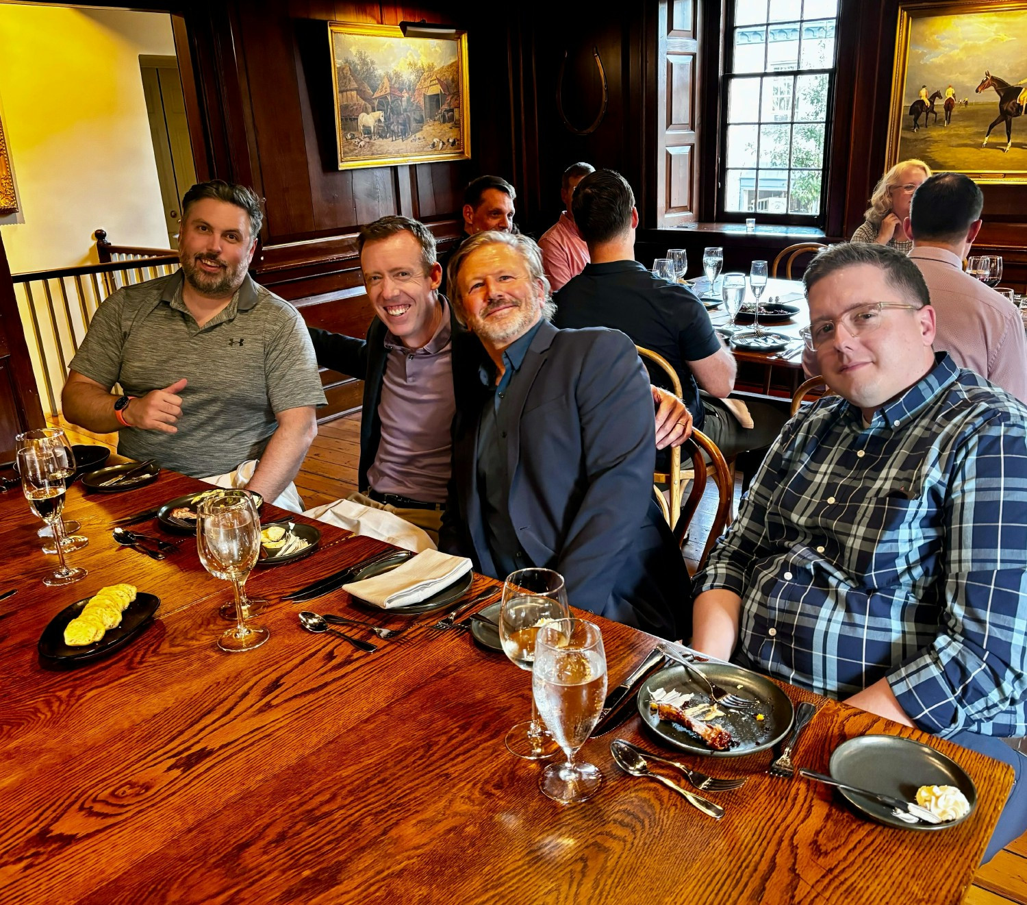 Group photo at dinner during a company retreat.