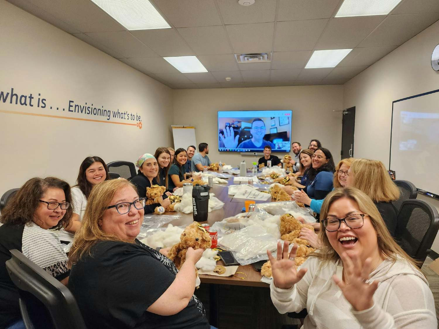 The JMA team assembles bears for a local charity to comfort children of deployed servicemembers.