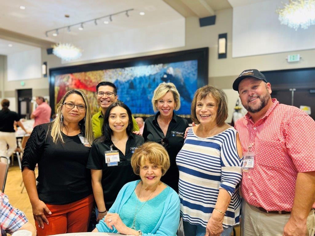 Residents, staff, and the President of the Board enjoying a resident activity.  