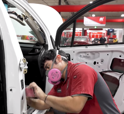 One of our body shop technicians working in our climate-controlled environment.  