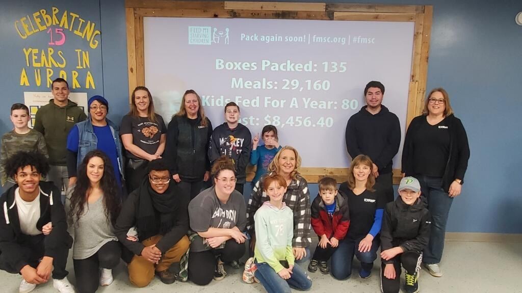 Some of our DRF team member and their families at Feed My Starving Family.