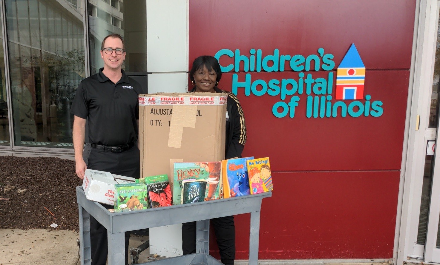 Brett delivers DRF book donations to the Children's Hospital of IL for Books for Babies.