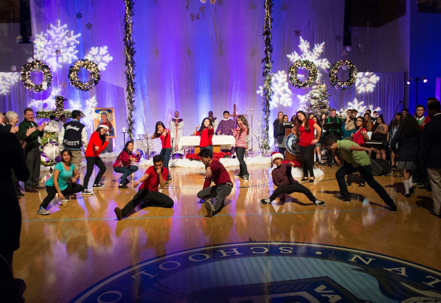 Students dancing during Advent Mass.